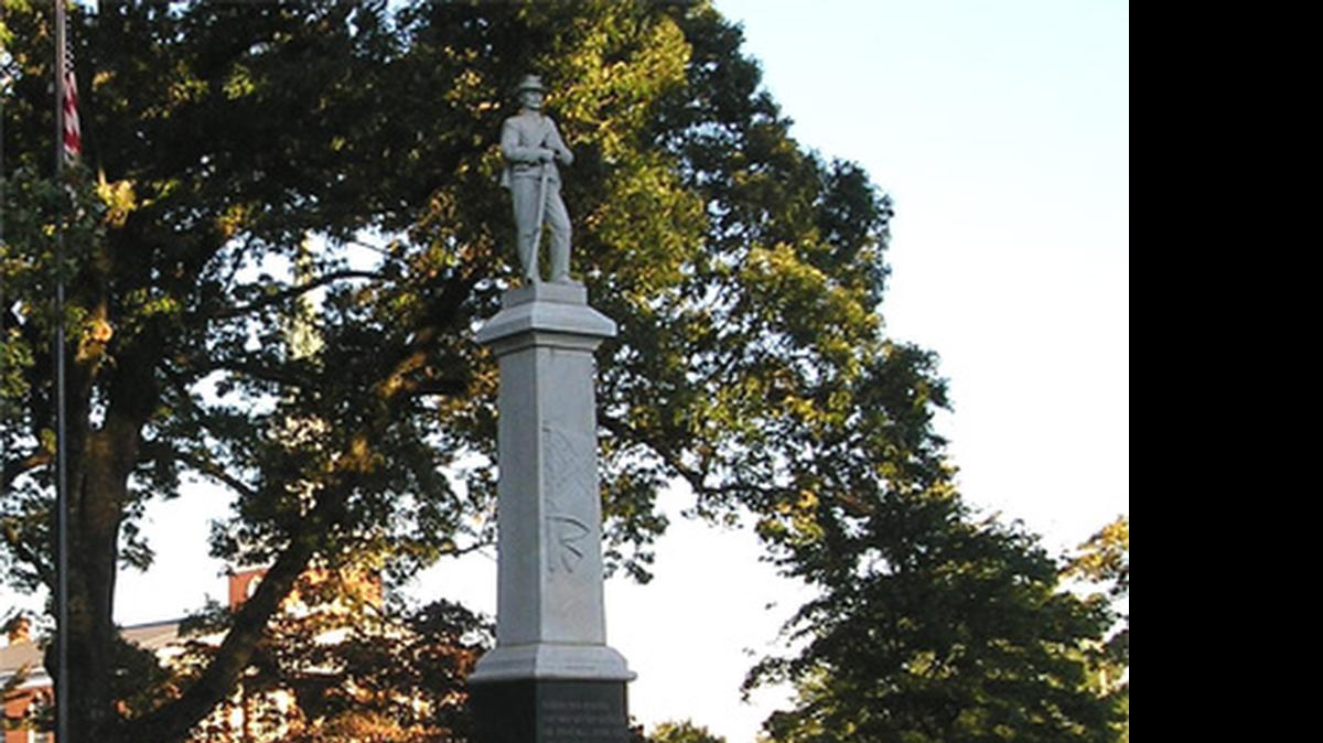 
The town of Cornelius covered much of this Confederate memorial with tarp after offensive words were written on it Sunday night or early Monday.
