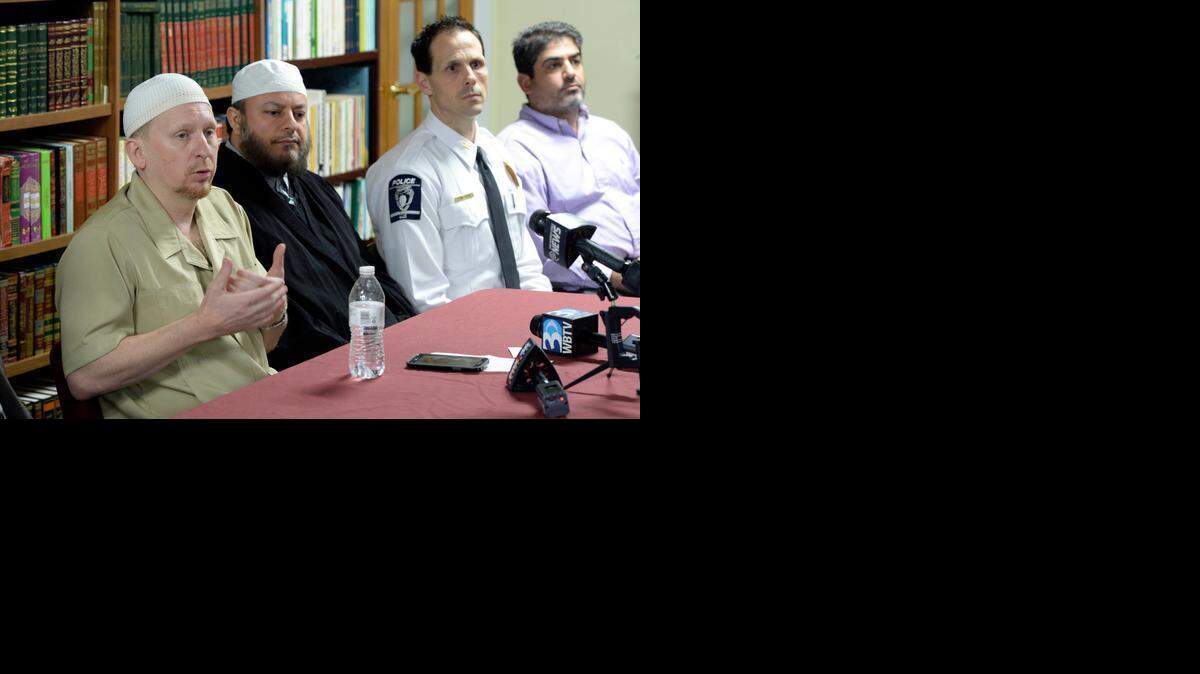
Jibril Hough (left), spokesperson for The Islamic Center of Charlotte answers a question during a press conference, as Imam Bassam Obeid, Charlotte-Mecklenburg Police Deputy Chief Jeff Estes, and Fadi Deeb listen, while on Wednesday, March 18, 2015. The Islamic Center of Charlotte held a news conference to address the recent shooting of one of the community member's home. Eighteen shots were fired and one person inside the home was injured. 
