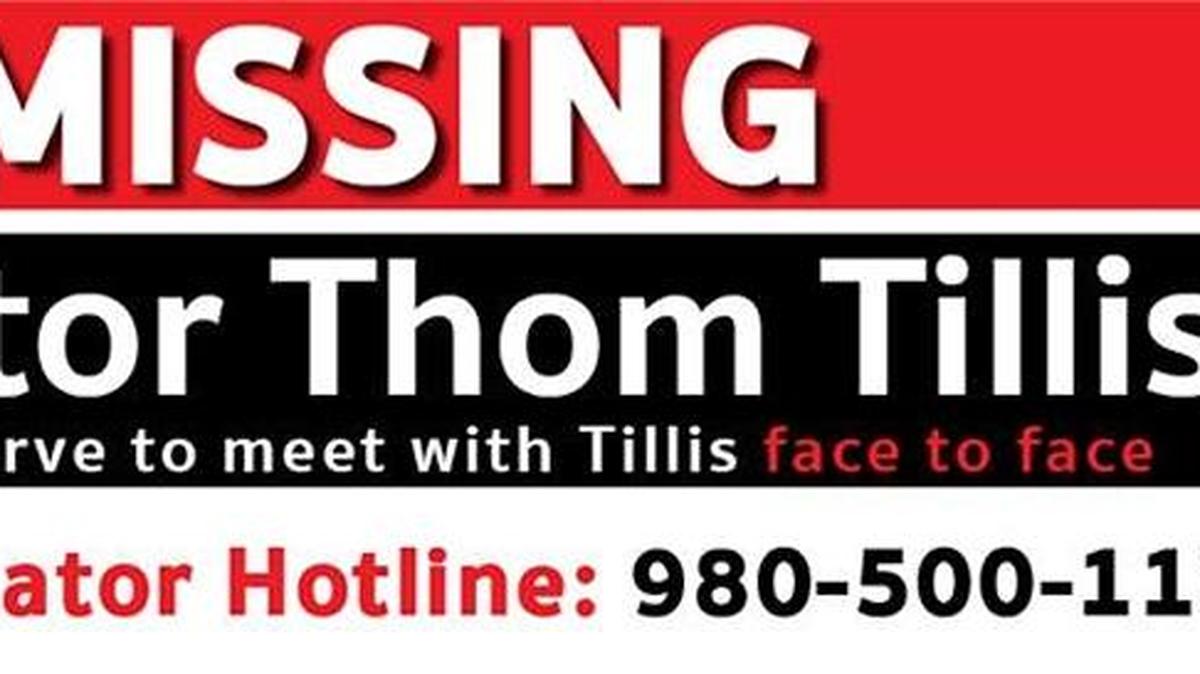 A billboard leased by Indivisible Charlotte and Indivisible Uptown Charlotte lampoons Sen. Thom Tillis for not holding town hall meetings.