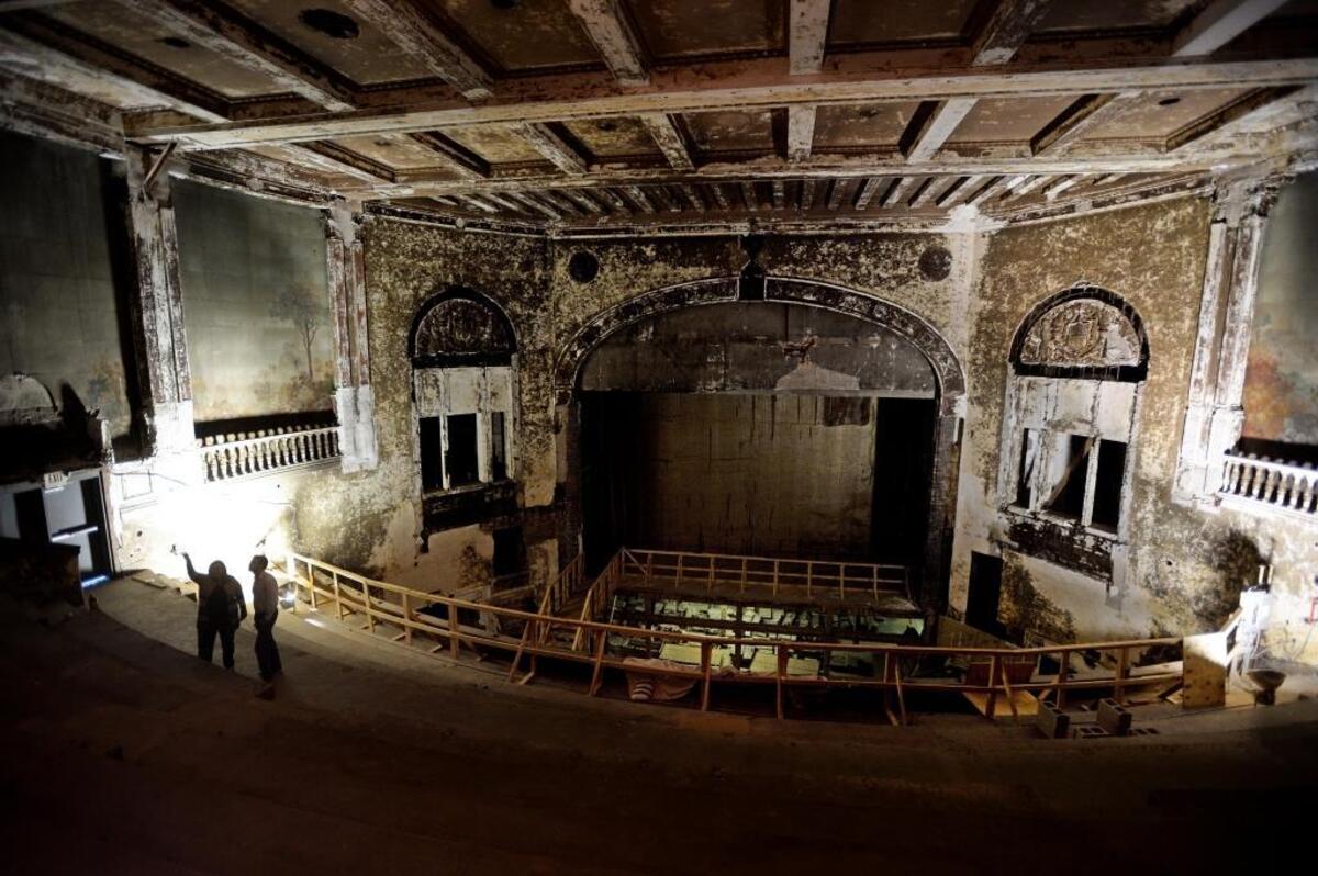 Visitors look at the interior of the closed Carolina Theatre building during an April 2017 walk-through.