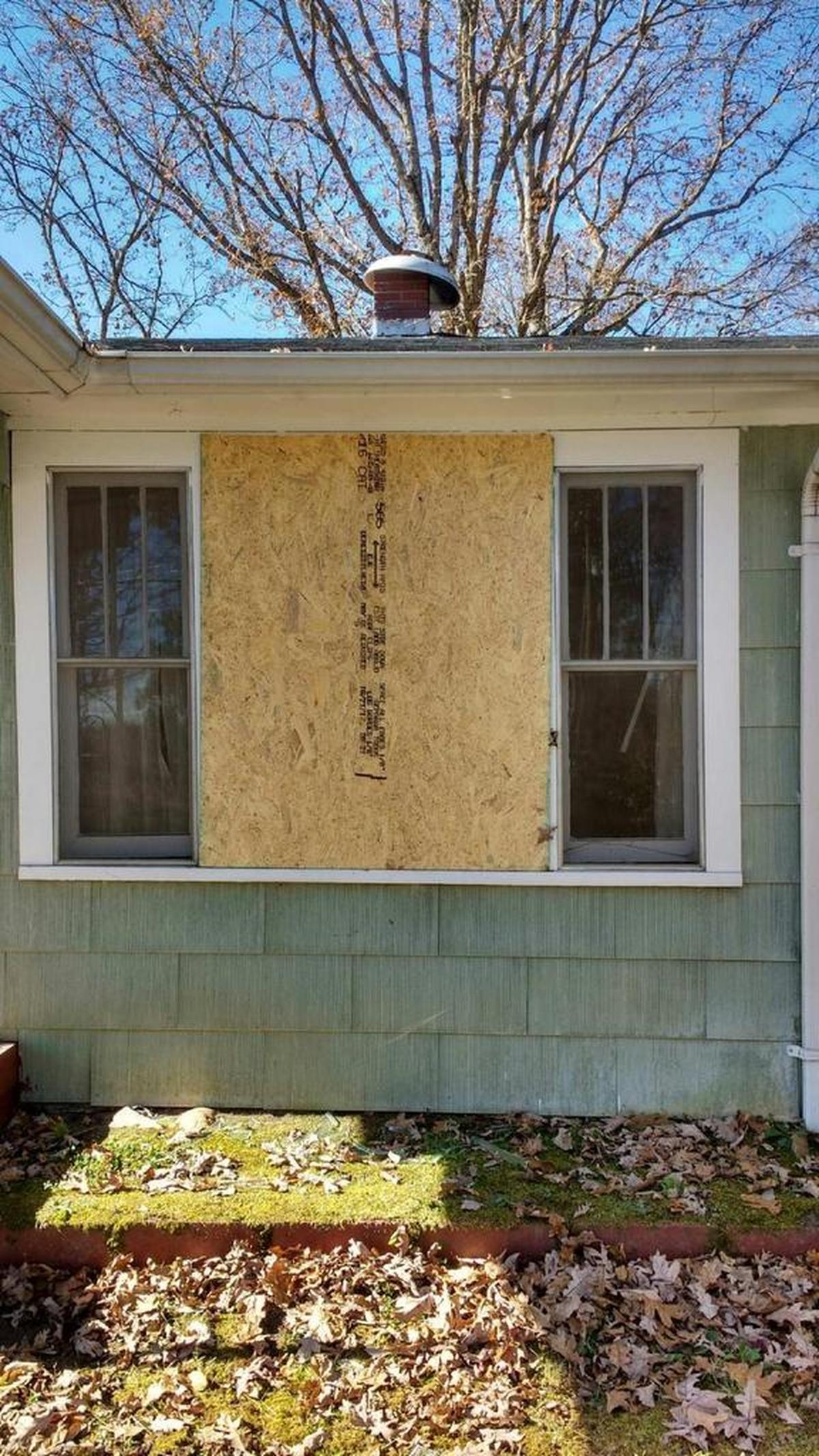 The boarded up window of Doris Coffey’s home in Hudson.