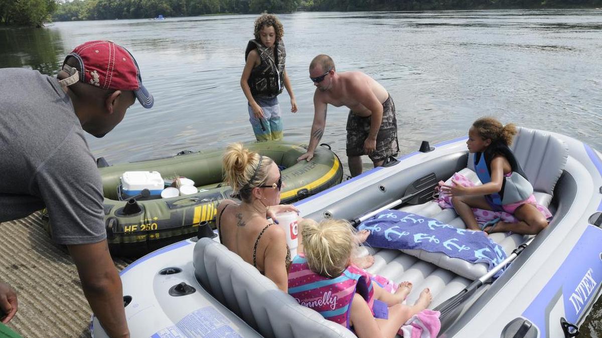 A family of tubers launches Saturday from the Lake Wylie dam.