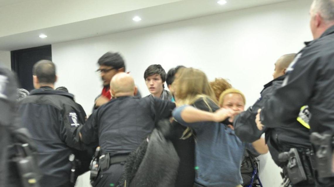 Protesters and police clashed at Charlotte Douglas International Airport on Saturday night as protesters called on Trump to rescind his executive order