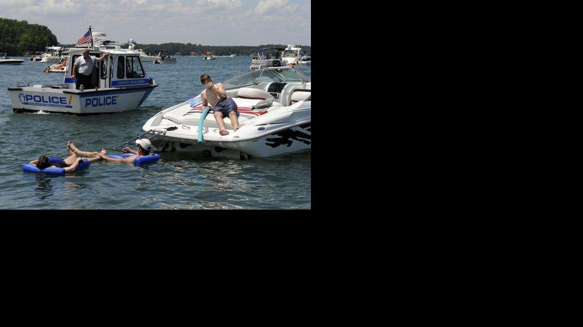 
2012 file – Charlotte-Mecklenburg Police Department's North Division-Lake Enforcement officers observe boaters gathered at the sandbar area of Lake Norman during Memorial Day 2012. Mecklenburg County commissioners approved the transfer of patrolling Lake Norman to the Cornelius Police Department.
