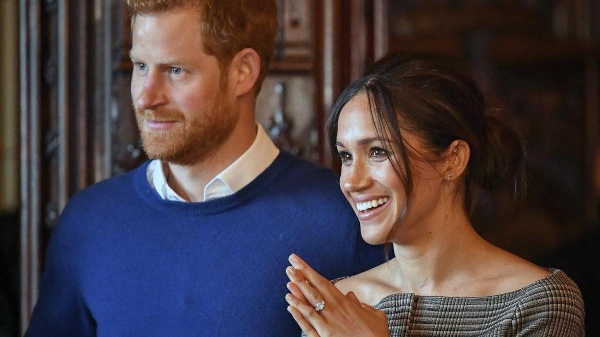 Britain’s Prince Harry and Meghan Markle watch a performance by a Welsh choir at Cardiff Castle in Cardiff, Wales, on Thursday. A 26-year-old woman from Charlotte met the royal couple and chatted with them as they greeted the crowd outside.