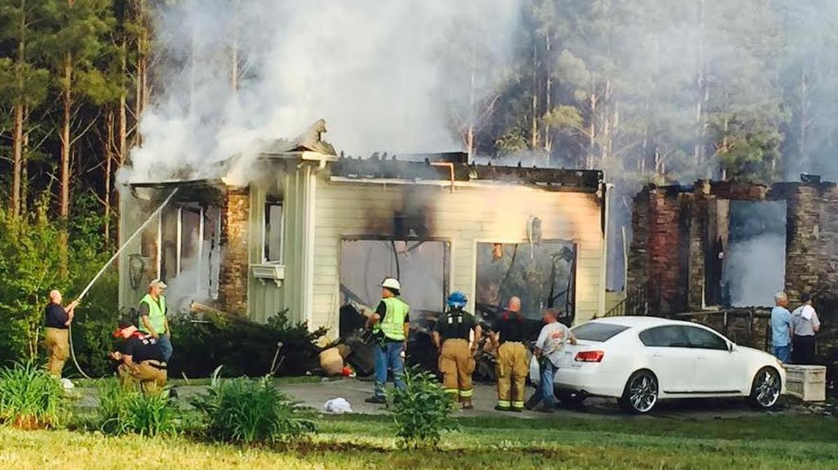 Firefighters from four departments responded to a blaze in rural Rock Hill that is believed to be have been caused by lightning during afternoon storms Monday.