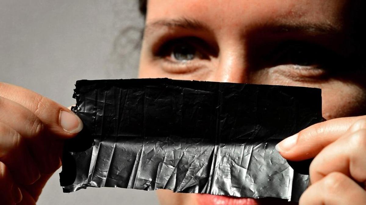 
Katie Hughes of International ThermoDyne, a CLT Joules startup, holds a layer of its PowerFelt product. 
