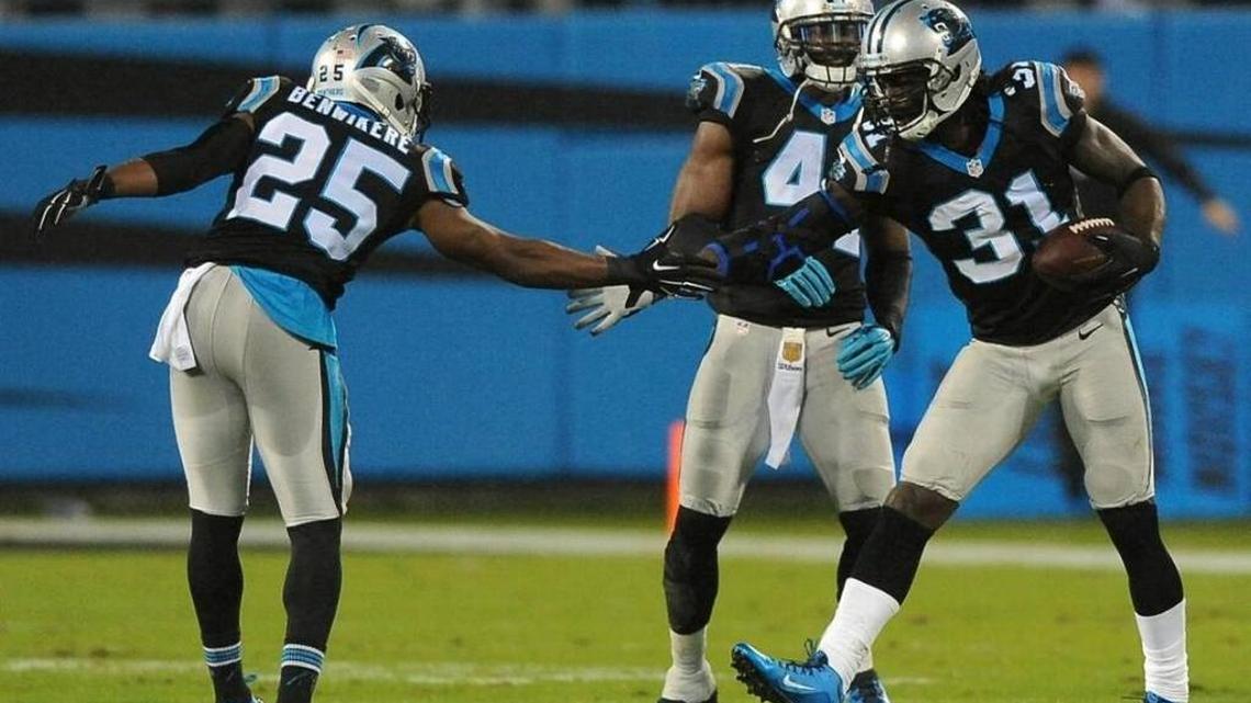 Carolina Panthers cornerback Charles Tillman, right, is congratulated by cornerback Bene Benwikere, left, after Tillman intercepted a pass meant for Indianapolis Colts tight end Dwayne Allen during first quarter action at Bank of America Stadium in Charlotte, NC on Nov. 2, 2015. The Panthers defeated the Colts 29-26.