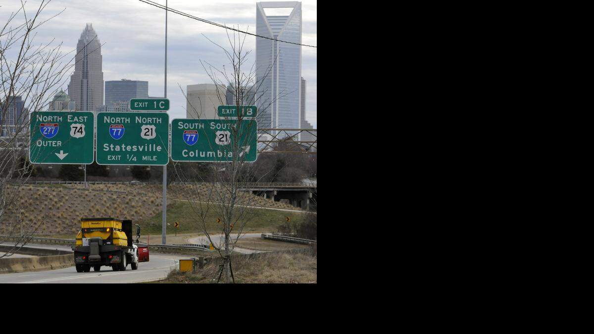 
A snow scraper heads toward uptown along Wilkinson Boulevard on Monday. The Charlotte region could see ice levels approach half an inch during Monday's winter storm, a National Weather Service meteorologist said.
