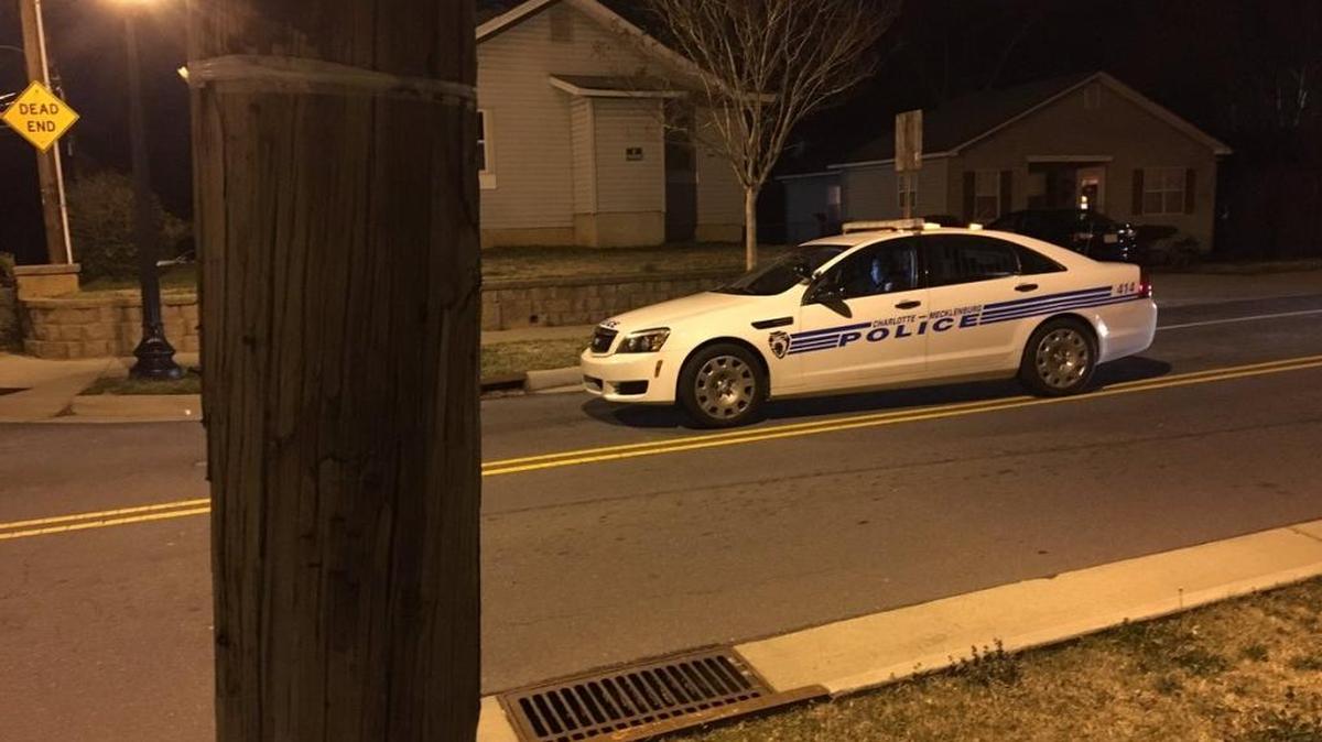 At least one bullet went through a home in early Friday morning as more than a dozen shots were fired in a parking lot near uptown Charlotte. No one in the home was injured.