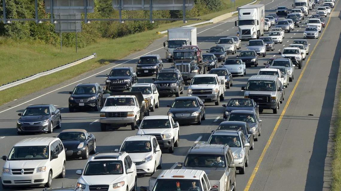 
 I-77 north bound traffic slowly advances at a crawl during the 5:30 PM commute on Oct. 02,2014, photo taken from the Hambright Road bridge near the 20 mile marker ,three miles south of Exit 23 in Huntersville. 
