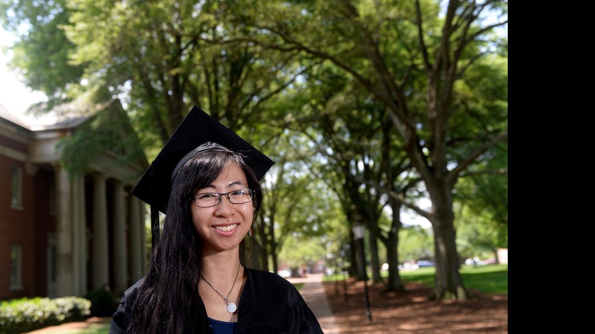 
Yeeva Cheng on the Davidson campus. She grew up in Shelby, but descends from Chinese parents whose families immigrated to India and Pakistan early last century. They are from the Hakka ethnic group of southern China that practices arranged marriages. Cheng graduates Sunday from Davidson College and will spend next year on a Watson Scholarhip studying overseas about that institution that she's not necessarily against. 
