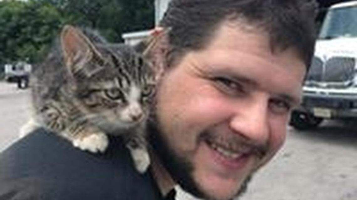 This kitten got stuck in the fender well of a Virginia woman’s minivan and survived a 45-mile trip unhurt. She clings to Leete Tire & Auto worker Chuck Williams, who immediately adopted her.