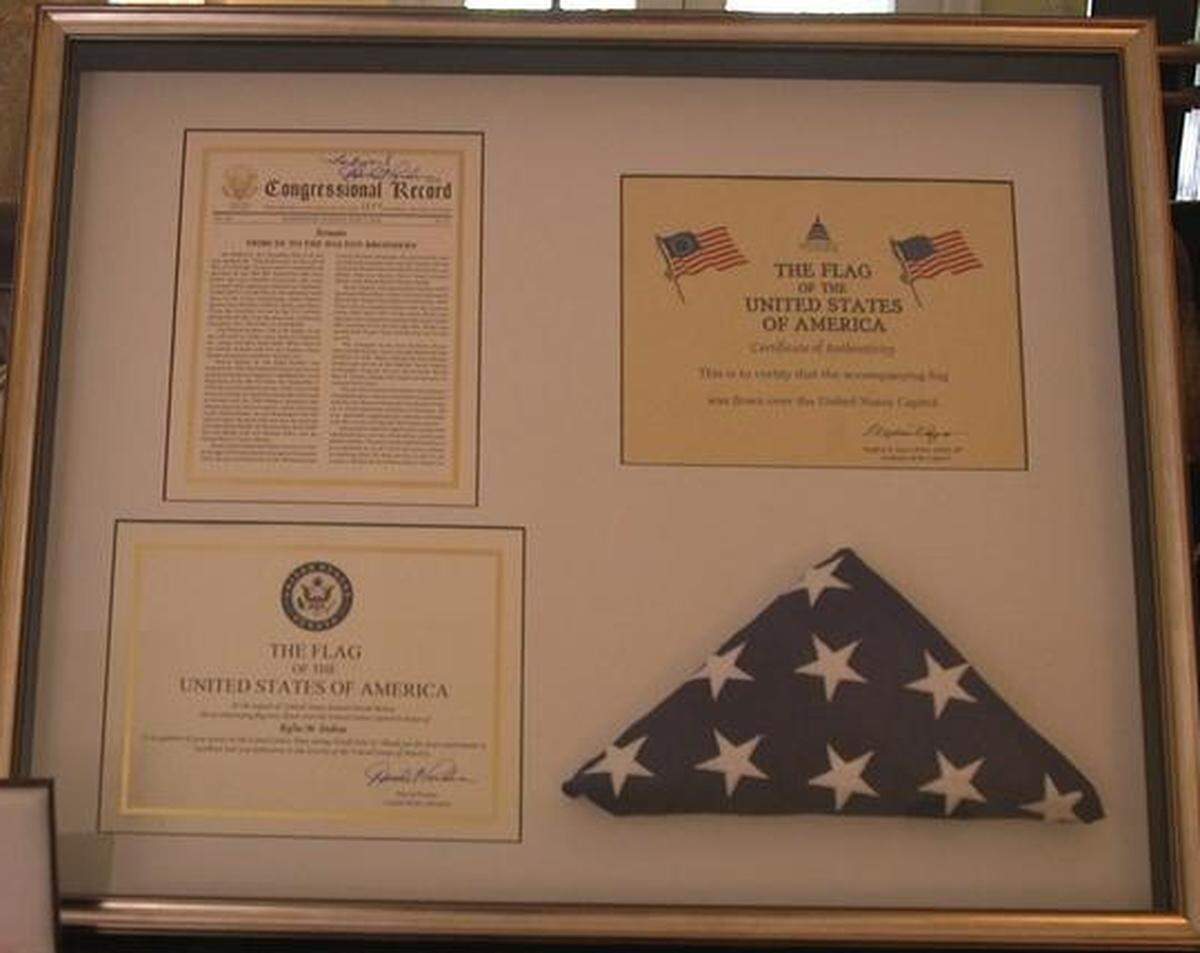The citations the four brothers received from the U.S. Senate earlier this year. The flag was flown over the Capitol Building in Washington, D.C.