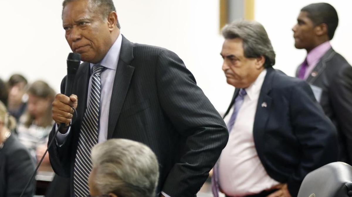 
NC State Senator Dan Blue (D-Wake County), left, stands to plead for more time for senators to read the budget compromise bill before them in the NC Senate Tuesday as fellow State Senator Bob Rucho (R-Mecklenburg County) listens before coming back to his seat in the NC Senate.
