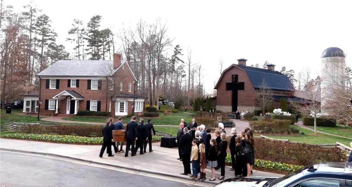Pallbearers carry the casket of the Rev. Billy Graham to the Billy Graham Library on Saturday, the conclusion of a 130-mile route with a 10-car motorcade that took off from Asheville in western North Carolina. He died in Montreat on Wednesday at age 99. An invitation-only funeral is set for Friday at the library.