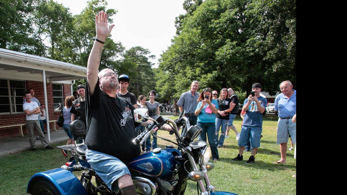 
RJ Lewis gives praise to the Lord as Bikes 4 Blessings and Riders of Faith Biker Church present him with a 1997 Harley Davidson 1200 Sportster trike at Sylvia Circle Baptist Church in Rock Hill.
