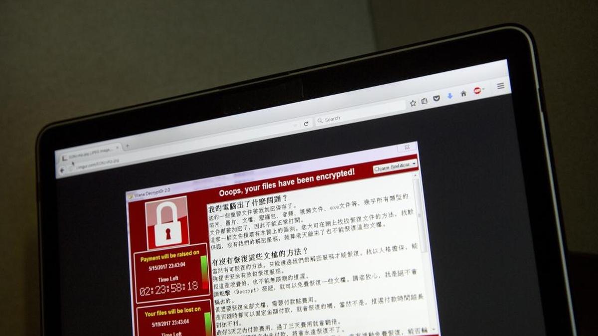 In this May 13, 2017, AP photo, a screenshot of the warning screen from a purported ransomware attack, as captured by a computer user in Taiwan, is seen on a laptop in Beijing. The FBI is investigating a ransomware attack that crippled the computer network of the Lincoln County, North Carolina, Sheriff’s Office.