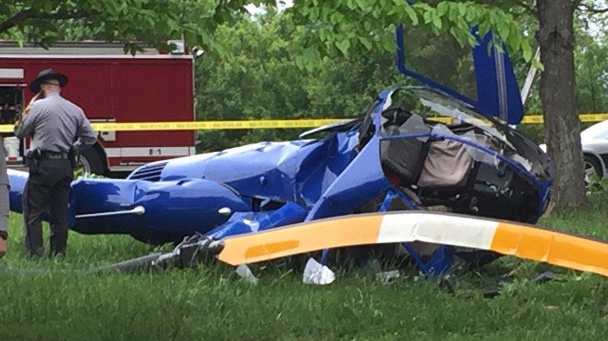 Two people were injured when a helicopter spun out of control, clipped a home and crashed in Catawba County on Thursday, Observer news partner WBTV reported.