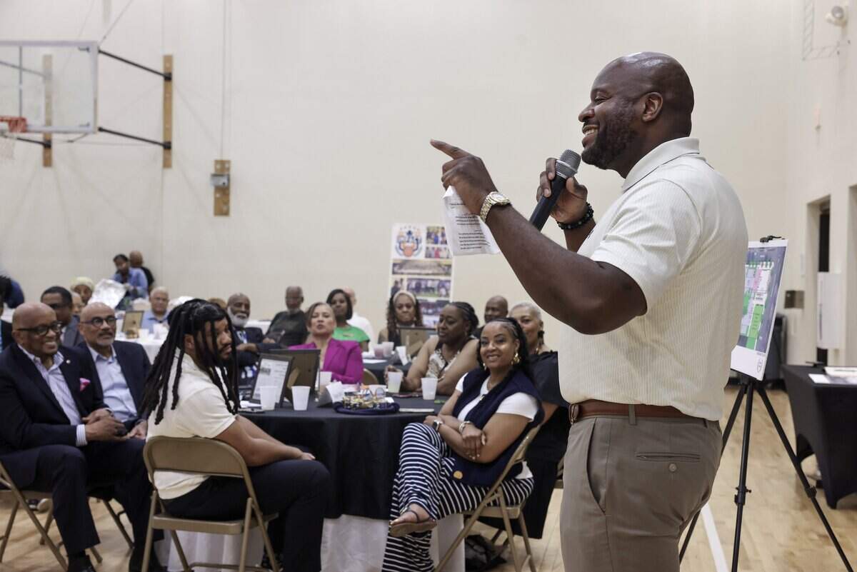 Shawn Kennedy, founder and chief developer of Kennedy Properties & Development, speaks to a crowd of supporters of a project to rebuild the Excelsior Club in Charlotte on Thursday, May 28, 2026 at First Baptist Church-West.