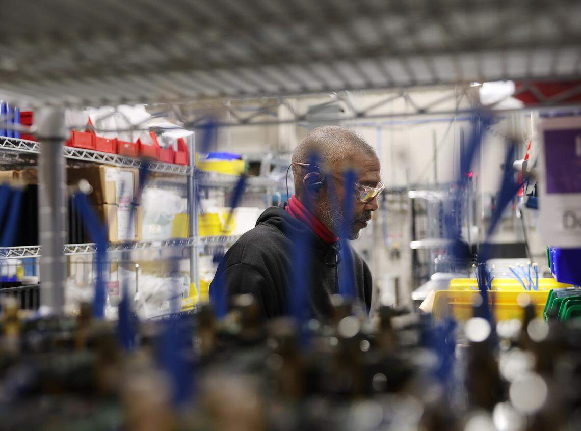 Benjamin Madison works in the Atom Power warehouse Tuesday, Feb. 24, 2026 in Huntersville, N.C.