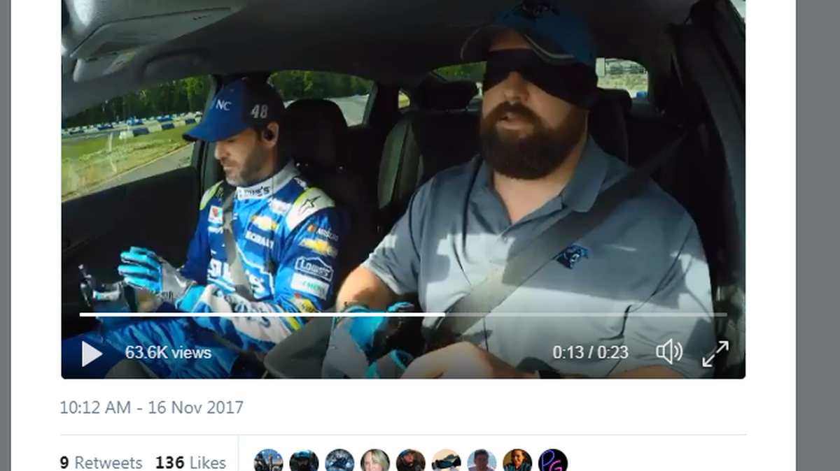 Ryan Kalil driving with a blindfold, with Jeff Gordon in the passenger seat.