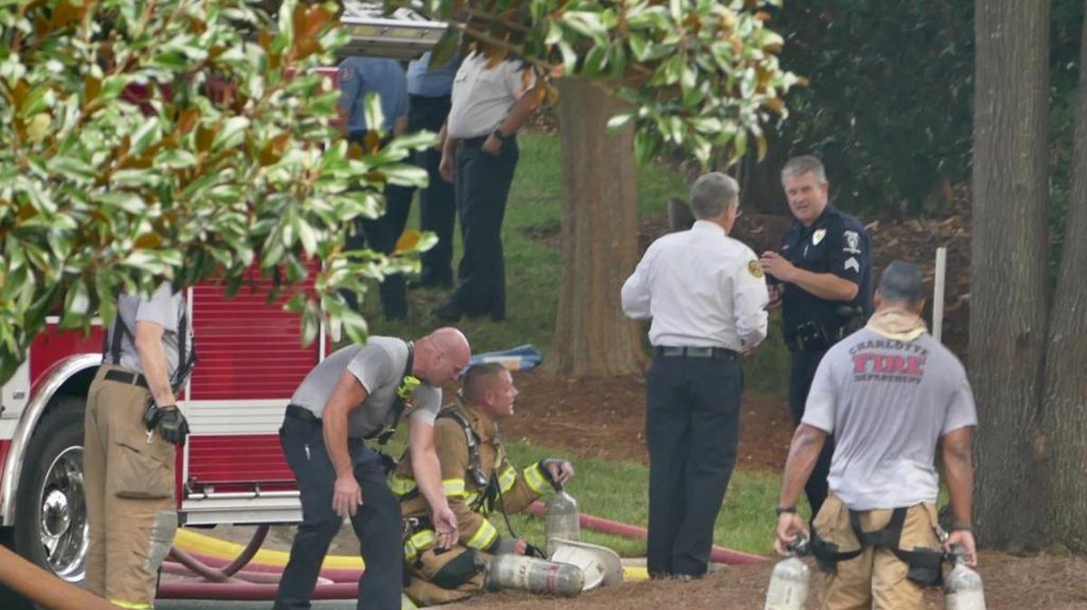 Firefighters take a break while battling a fire in the 7000 block of Old Dairy Lane. Nobody was home, and pets were rescued.