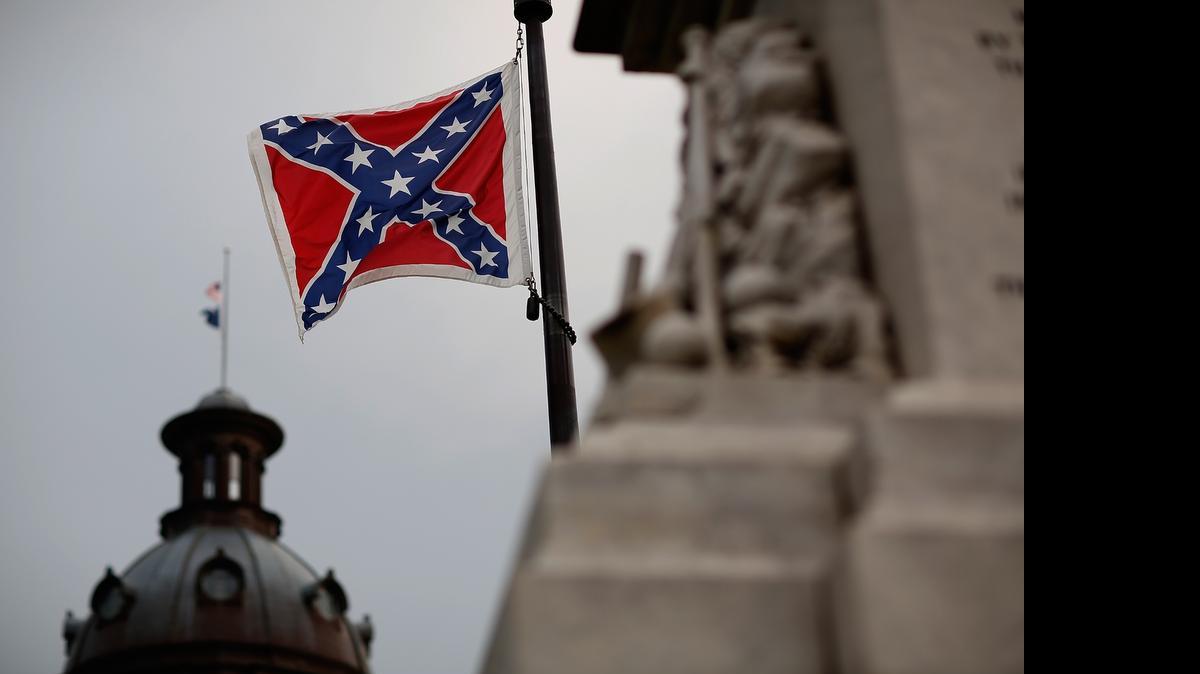 
The Confederate flag flies on the South Carolina Capitol grounds on June 23, 2015 in Columbia, South Carolina. South Carolina lawmakers expect to approve flag-removal bills next week.
