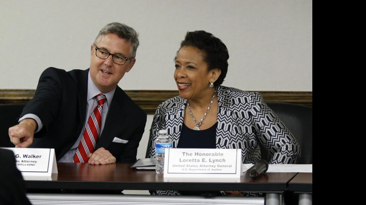 
From left, US Attorney Thomas G. Walker for the Eastern District of NC points out familiar faces in the audience to US Attorney General Loretta E. Lynch just before the start of a meeting and discussion on the human trafficking issue at the US Federal Building in downtown Raleigh Wednesday morning. Attorney General Lynch was in Raleigh for the meeting and Wednesday afternoon will meet with civil rights and community leaders at NC Central University in Durham NC. Lynch lived in Durham, NC from age 6. Her parents still live in the area. This is Lynch's first official visit to Raleigh-Durham since her confirmation as the 83rd US Attorney General earlier this year.
