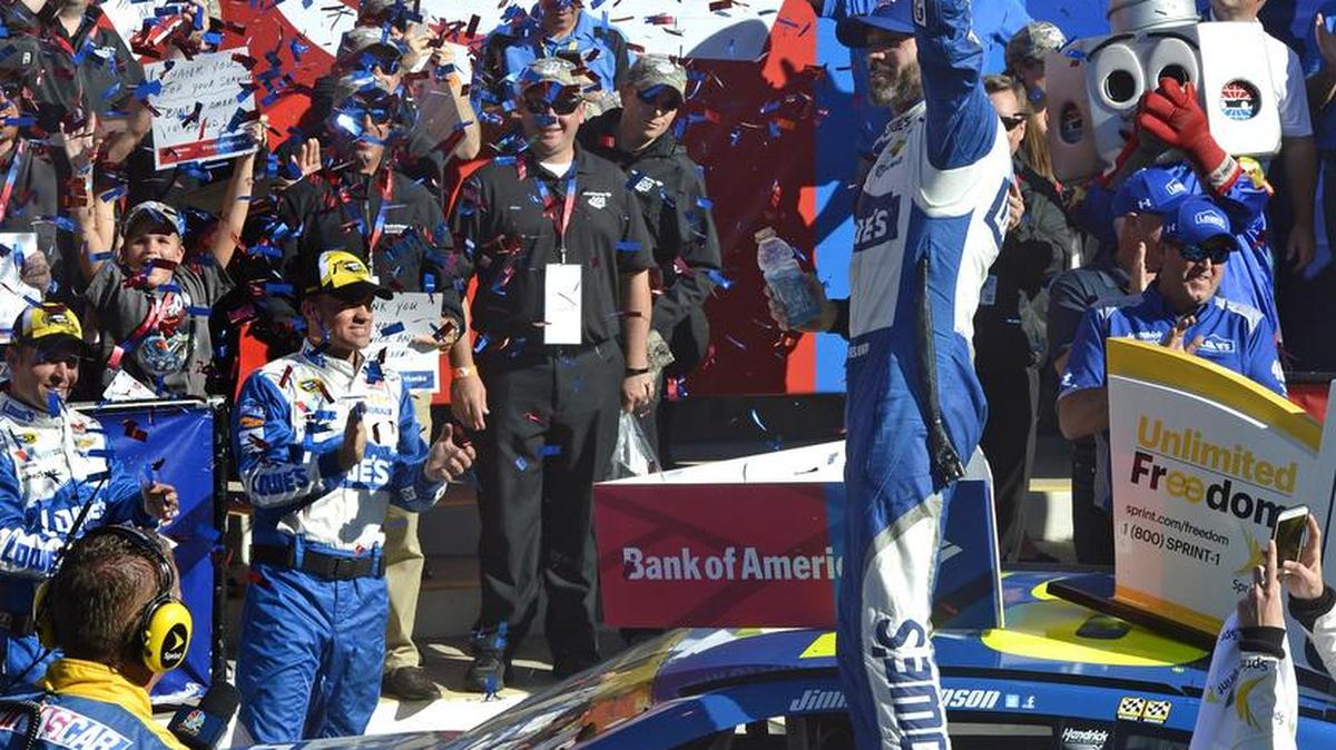 Jimmie Johnson celebrates in victory lane after winning the 37th Annual Bank of America 500 NASCAR Sprint Cup Race at Charlotte Motor Speedway on Oct. 9.