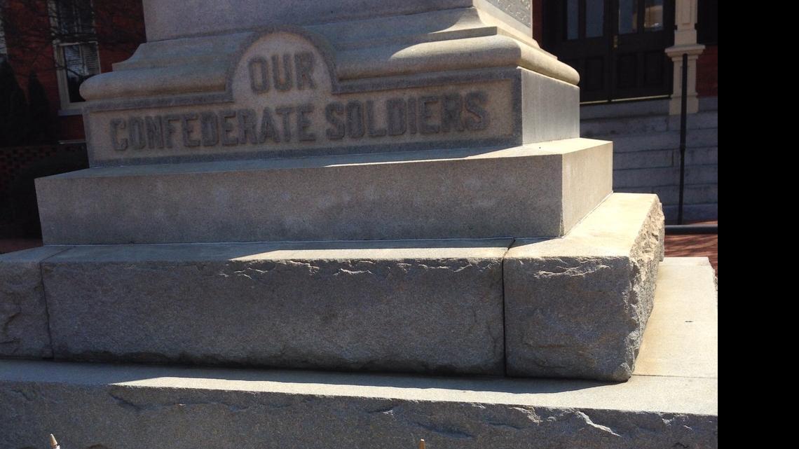 
Small Confederate flags lined the Confederate memorial at the Old County Courthouse in Monroe in April. Confederate flags were removed from the site this week by the county, which said it had not given approval for the flags to be on its property.
