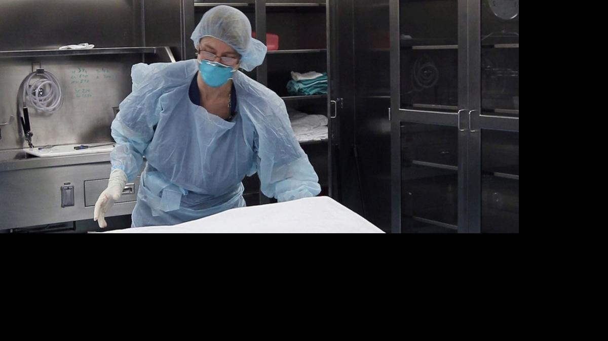 
Budget proposals by the House, Senate and Gov. Pat McCrory would enhance the state medical examiner system and increase fees paid for autopsies, Here, Judith Page, an autopsy technician, cleans up after performing an autopsy at the state medical examiner’s office in Raleigh. 



