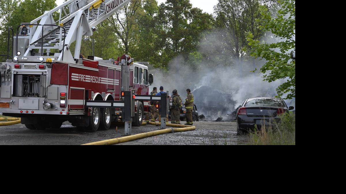 
Firefighters work to extinguish a fire that collapsed a metal building in the 500 block of Valleydale Road in northwest Charlotte on May 13, 2015. Charlotte Fire has received the highest rating possible from the Insurance Services Office.
