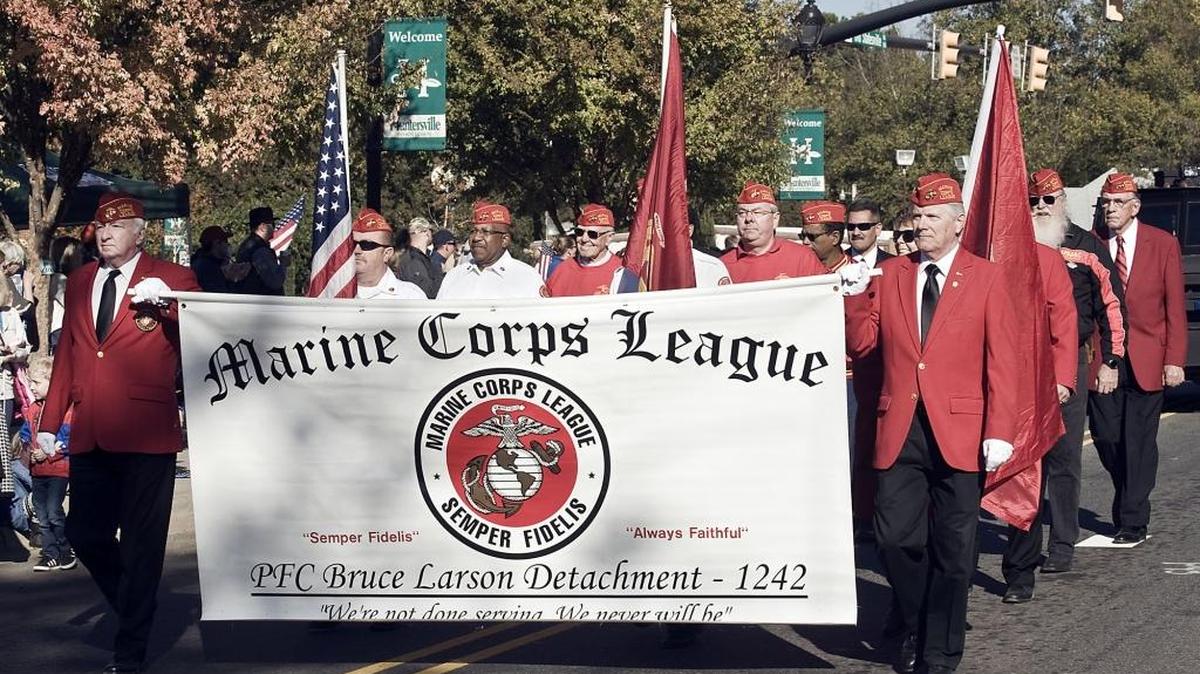 Members of the Marine Corps League march down Old Statesville Road as part of the parade during the Huntersville Veterans Day celebration on Nov. 11, 2016.