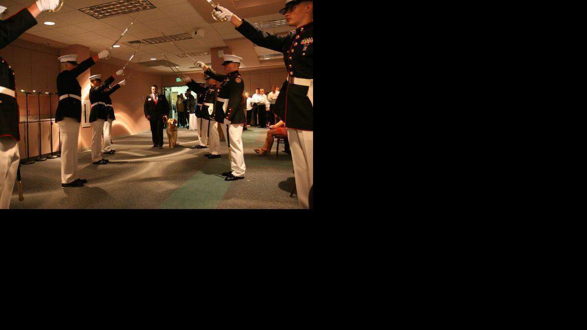 
A Purple Heart recipient receives a saber salute at a 2013 dinner in Winston-Salem honoring area veterans who had earned that medal. A North Carolina foundation plans to hold its annual dinner for the recipients in Charlotte this year. 
