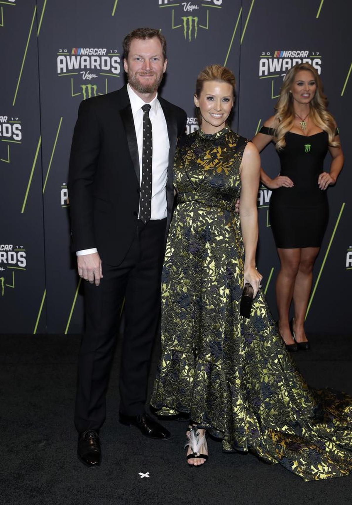 Dale Earnhardt Jr., left, and his wife, Amy Earnhardt, arrive at the NASCAR Cup Series auto racing awards in Las Vegas on Thursday.