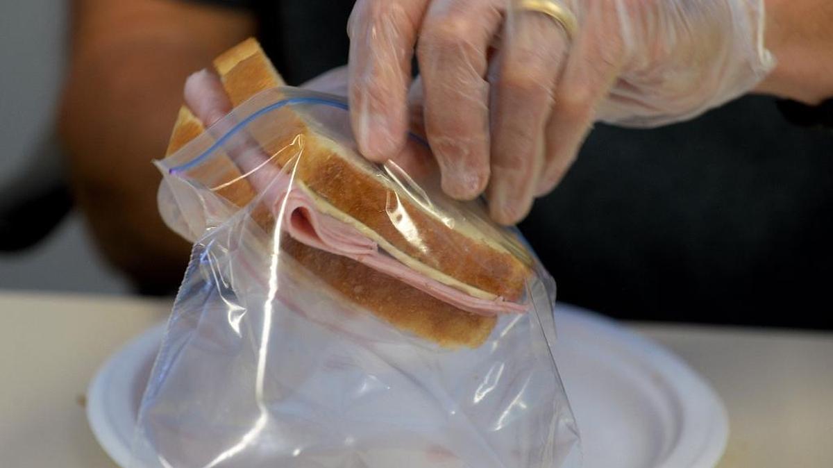 University of Arkansas fans plan to volunteer to make sandwiches for the homeless neighbors at Urban Ministry Center on the morning of the Belk Bowl Dec. 29, when the Razorbacks play the Virginia Tech Hokies.