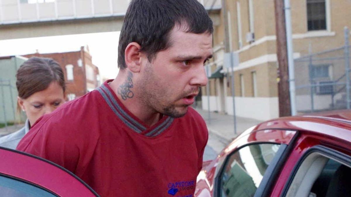 Timothy Allan Harmon turned himself into Caldwell County deputies Friday after he was wanted in connection to a Thursday morning apartment fire.