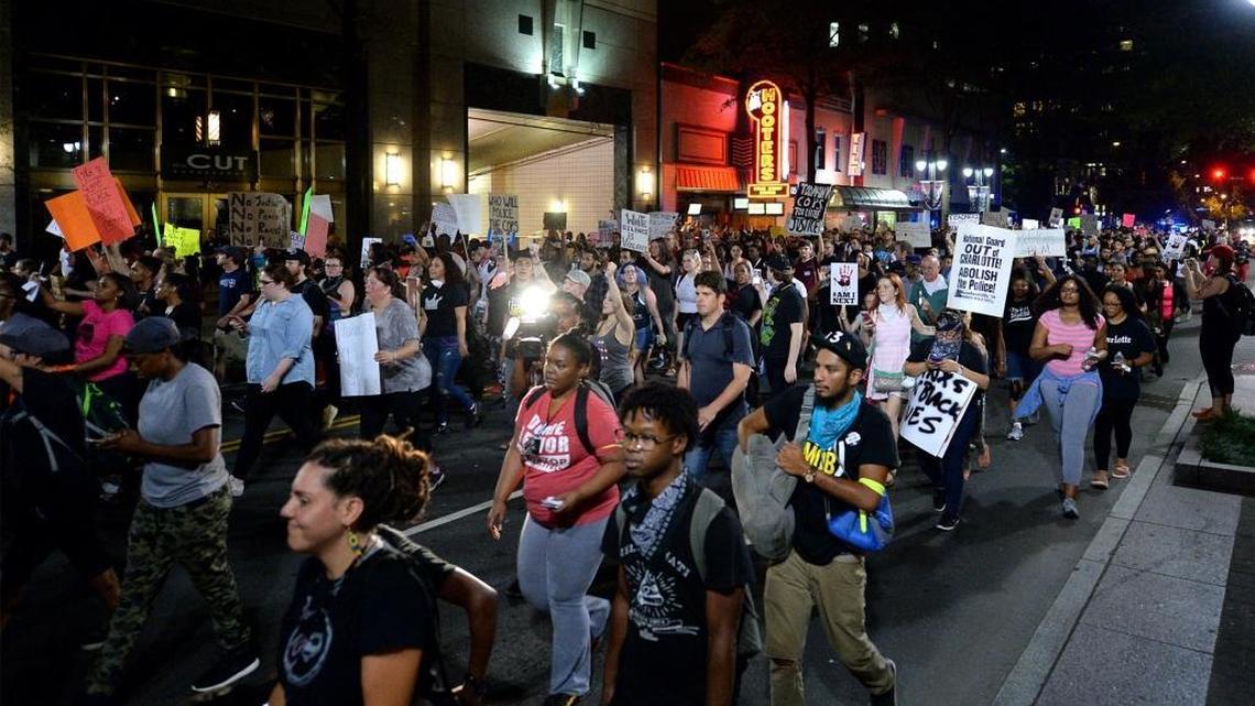 Protesters march down Trade Street in Charlotte on Sept. 24 in response to the fatal police shooting of Keith Lamont Scott.