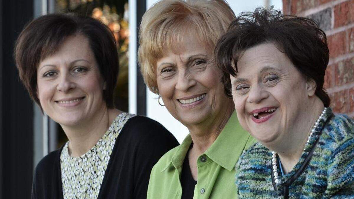Holy Angels resident Lorraine Giannini (right), 52, and her mother, Jean Giannini (center), 77 and Lorraine's sister, Karen Jarvis (left), 50 were in Mount Holly running through their speeches for the program at a Holy Angels gala on Saturday Nov. 21, 2015. Jean and Karen are from Winston-Salem.