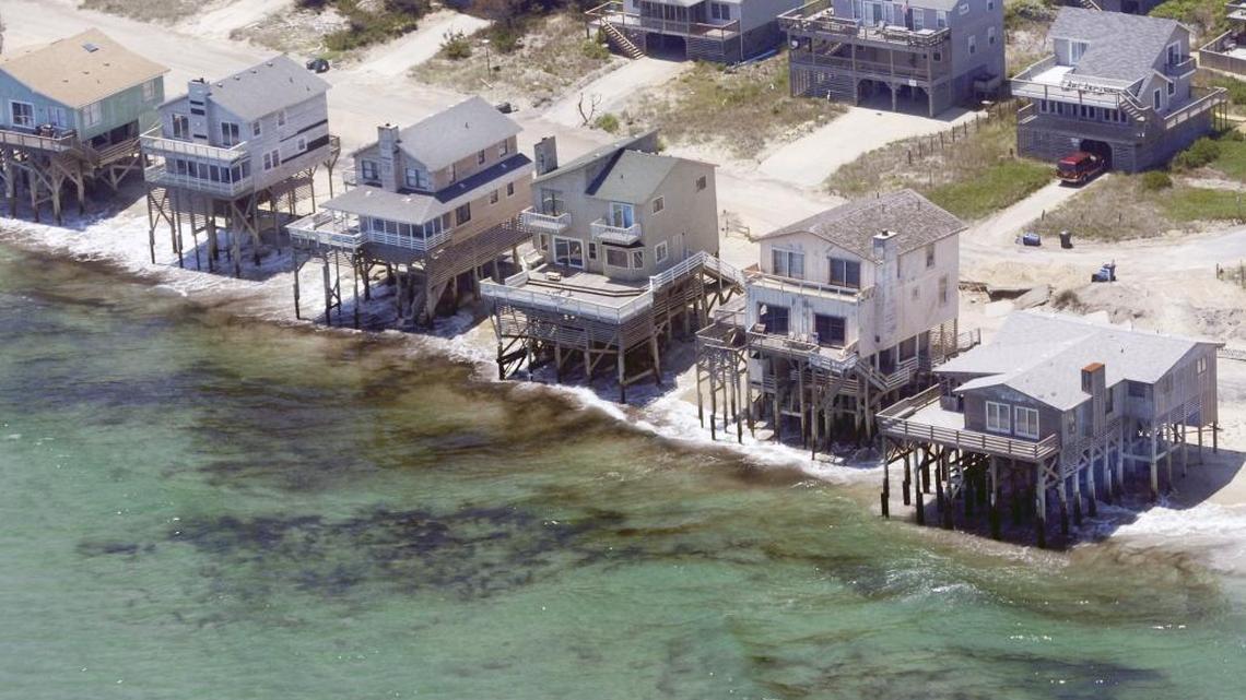 Erosion left some beach homes in Nags Head, seen in this 2011 photo, perilously close to the Atlantic Ocean. A national advocacy group gives North Carolina a “D” grade for its protection of the coast and beaches.