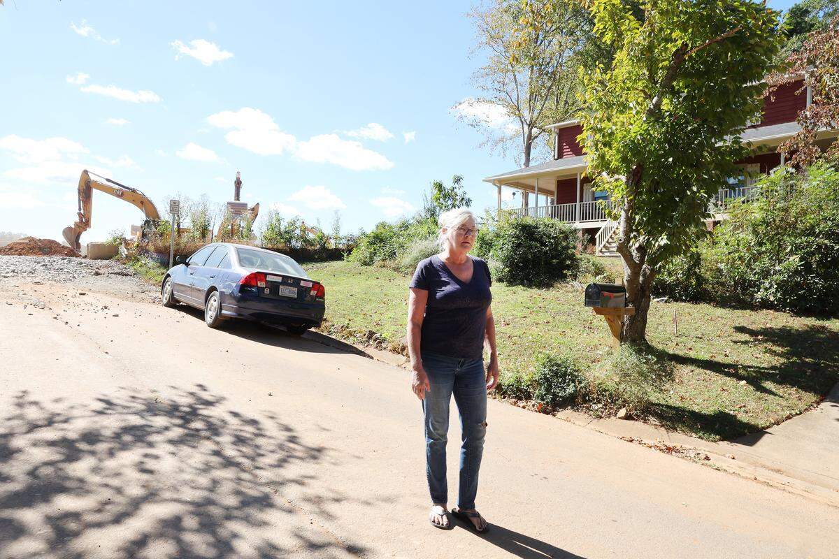Jennifer Roach stands in front of her home in Autumnwood  next to the Blakenship development. As construction on more than 600 homes begins, Roach says the experience has been a nightmare. 