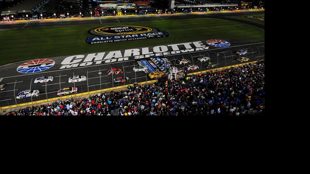 
The field in the Sprint All Star Race cross the start/finish line at Charlotte Motor Speedway in Concord on May 17, 2014. 
