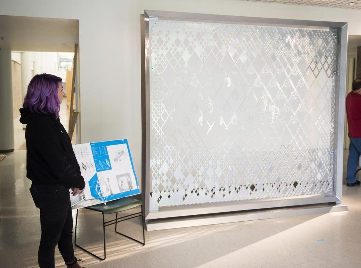 McKenzie Canaday stands beside the framework for Effervesce, which will be fully constructed at the American Institute of Architects convention in Orlando.