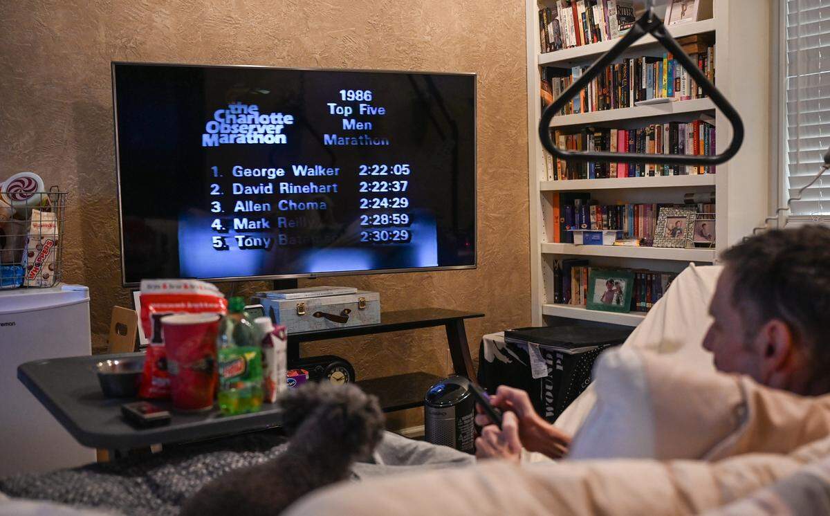 George Walker of Mint Hill, photographed in November while watching a YouTube video featuring a recap of his victory at the 1986 Charlotte Observer Marathon. Walker, 64, died from amyotrophic lateral sclerosis (ALS) this week.