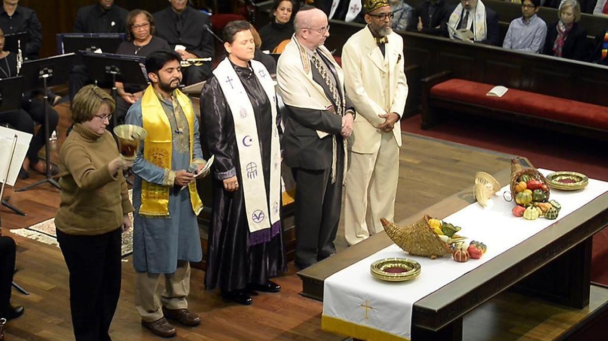 In this file photo, Laura Baxley, left, rings a bell as Hemant Amin, the Rev. Christy Snow, Cantor Elias Roochvarg and Amin Shareef wait to give their faiths’ call to worship during the 2016 Interfaith Thanksgiving Service sponsored by MeckMin.