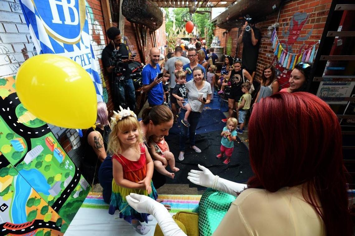 Fincher Nelson, 3, greeted Brandon James after the story time.