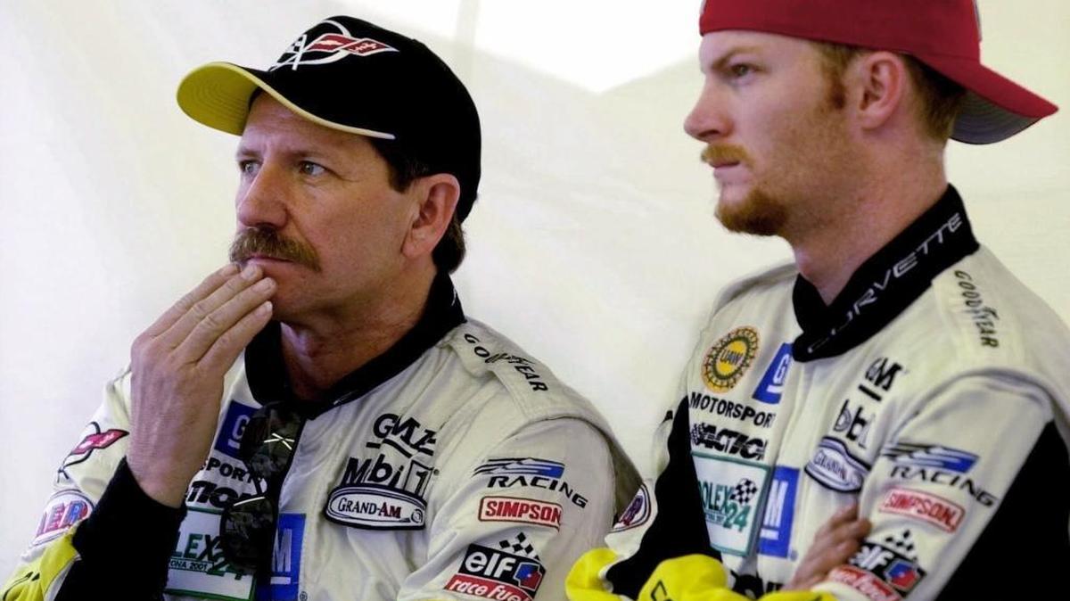 Dale Earnhardt and his son Dale Earnhardt Jr. watch a race at Daytona International Speedway on Feb. 1, 2001. The elder Earnhardt died in a crash at Daytona 17 days later.