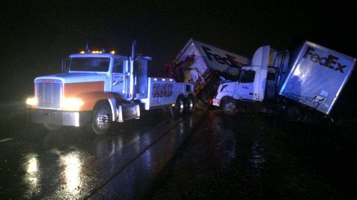 A disabled FedEx truck with two trailers is blocking lanes of Interstate 85 southbound in Belmont on Thursday morning.
