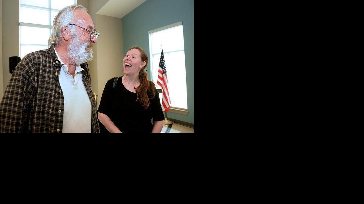 
Alfred Gorman, left, jokes with Liz Clasen-Kelly, associate executive director of the Urban Ministry Center, during a press conference on April 1, 2015, at Moore Place. Gorman was found during the chronic homeless registry initiative and has been housed since the registry was completed two months ago.
